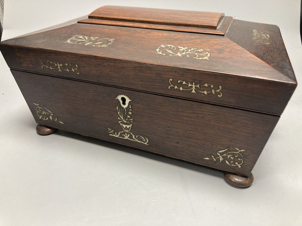 A Victorian mother of pearl-inlaid rosewood sewing box, containing various accessories, lace bobbins, etc.